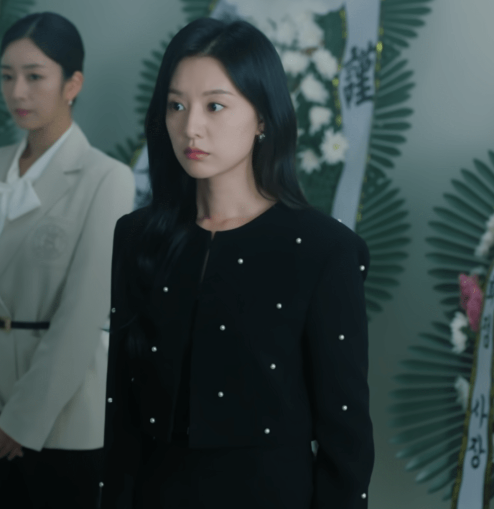 Queen of Tears. Kim Ji-won in black jacket.